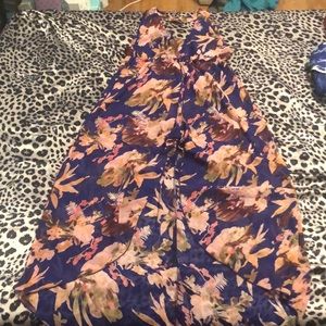 BEAUTIFUL halter and shorts jumper with a wrap like skirt that slits at middle